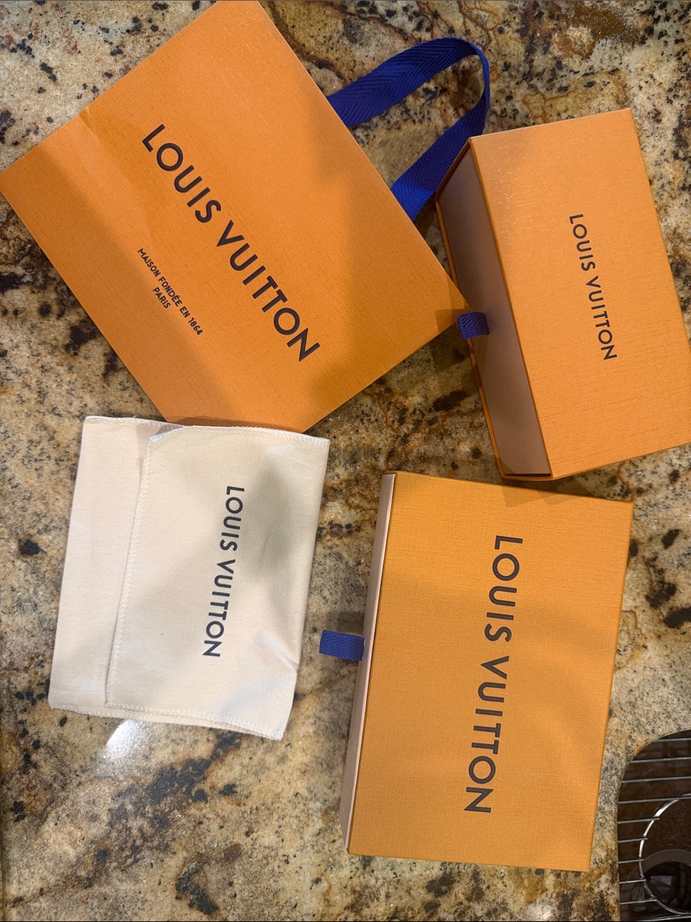 Louis Vuitton Orange Boxes  (2) with Navy Ribbon and one Cream Dust Bag.